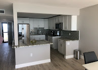 Finished kitchen with painted walls and cabinetry